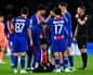 Khvicha Kvaratskhelia receives assistance after sustaining his knee injury against Barcelona