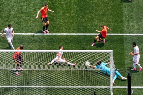 Iran goalkeeper Alireza Beiranvand makes a save from Belgium's Maxim De Cuyper.
