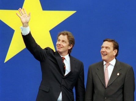 Tony Blair and German chancellor Gerhard Schröder, both in suits against a backdrop of yellow star on blue.