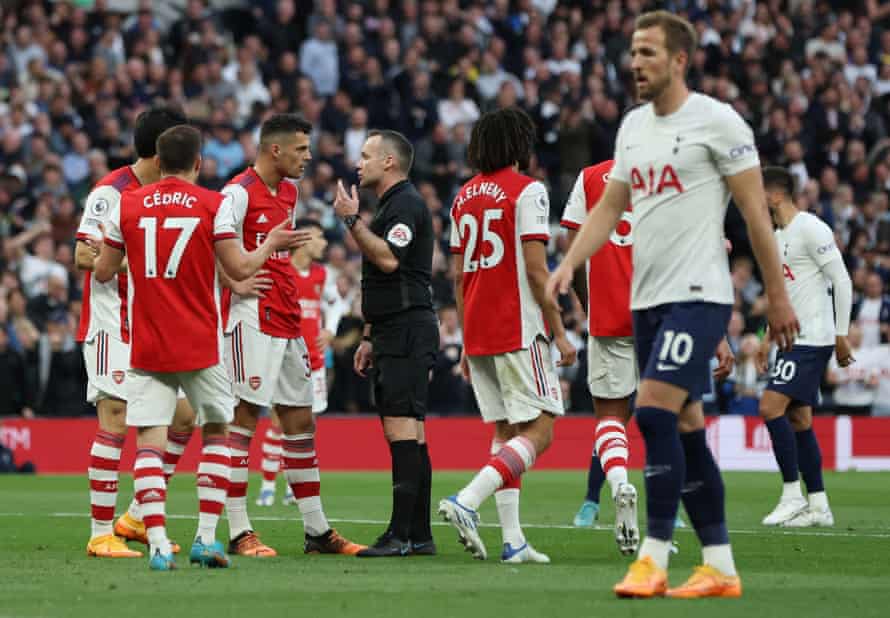 Referee Paul Tierney with Arsenal’s Granit Xhaka after awarding Tottenham Hotspur a penalty.