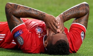 Bayern Munich’s German defender Jerome Boateng reacts after an injury.