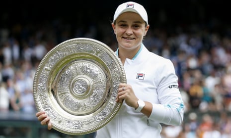 Ash Barty of Australia poses with the winner’s trophy at Wimbledon.