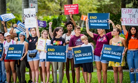 Members of March For Our Lives are joined by members of the community to protest Walmart gun sales in Coral Springs, Florida.
