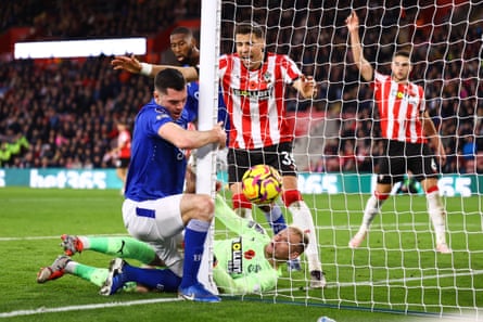 Southampton goalkeeper Aaron Ramsdale blocks the ball from crossing the line as Everton’s Michael Keane collides with the post during their match at St Mary’s
