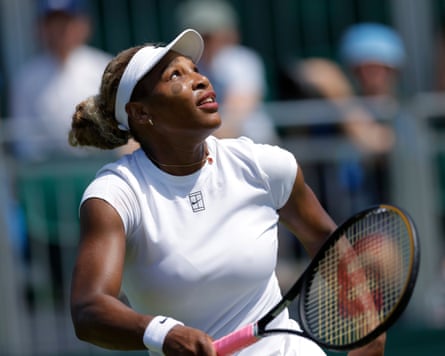 Serena Williams looks up at the ball during practice on Court 12 at Wimbledon