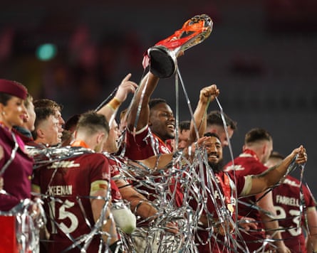 Maro Itoje lifts the series trophy, surrounded by his British & Irish Lions teammates