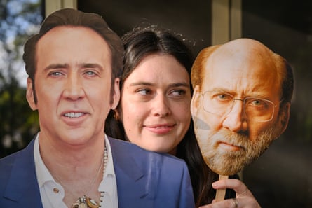 Creagh with the cardboard cutout and a paper Cage mask