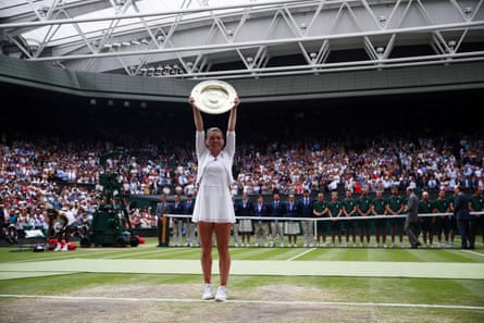 Simona Halep poses with the trophy after winning the women’s singles in 2019