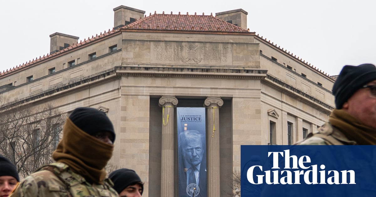 Large Trump banner hung at justice department headquarters