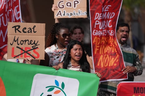 Activists participate in a demonstration for climate finance outside the Cop30 venue in Belem.