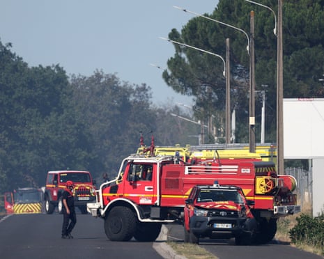 Fire engines are parked outside a building where a fire broke out and where two firefighters died whilst fighting the blaze in Merignac, not far from Bordeaux-Mérignac airport, France.
