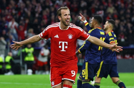 Harry Kane celebrates with arms outstretched after scoring for Bayern Munich
