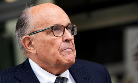 Rudy Giuliani speaks with reporters at a federal courthouse in May