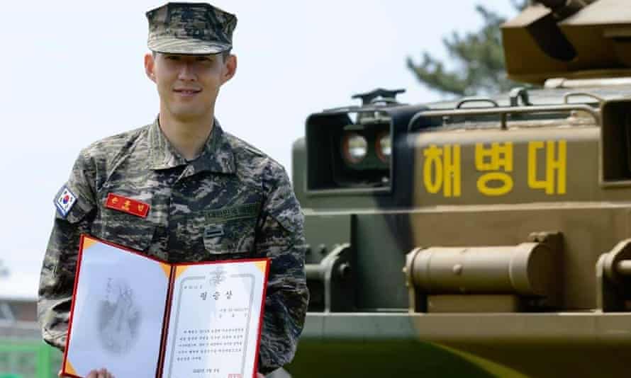 Son Heung-min smiles during a completion ceremony at a military camp in Jeju, South Korea.