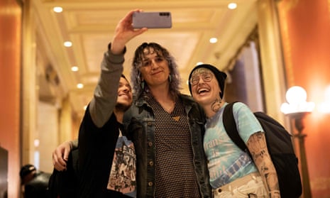 Minnesota State Representative Leigh Finke poses for a photo with supporters before the Minnesota Senate introduces the Trans Refuge Bill at the State Capitol Building in Saint Paul, Minnesota, on April 21, 2023. - The Minnesota legislature passed a