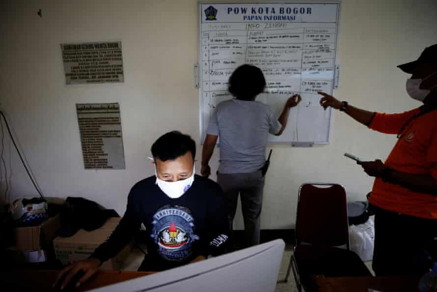Volunteer undertakers work at the group’s headquarters during a shift recovering the bodies of those who have passed away due to complications related to COVID-19