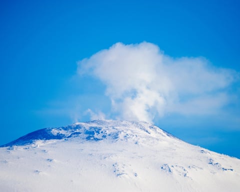 The smoking summit of Mount Erebus an active volcano in Antarctica.