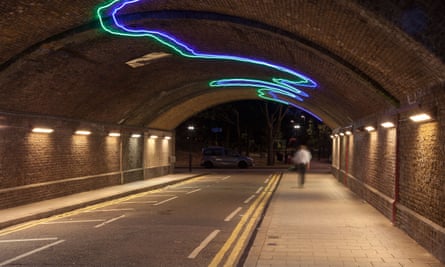 Person walking alone down an underpass late at night,Vauxhall,London