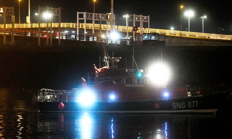 A French volunteer sea rescue organisation boat carrying the bodies of some of those who drowned arriving at Calais harbour on 24 November 2021