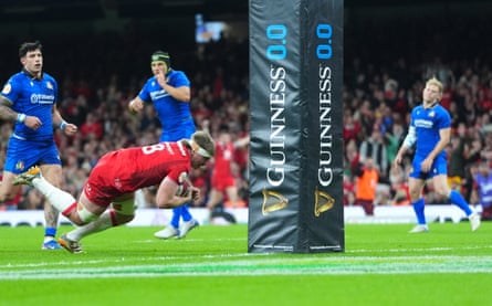 Aaron Wainwright dives home for the first of his two tries in the match.