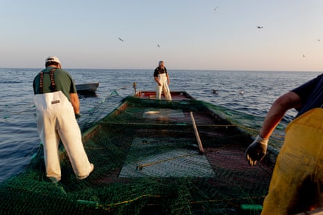 Don Tadgerson, Joel Cameron and Aaron Lothrop pull in one of the fishing nets on Lake Superior.