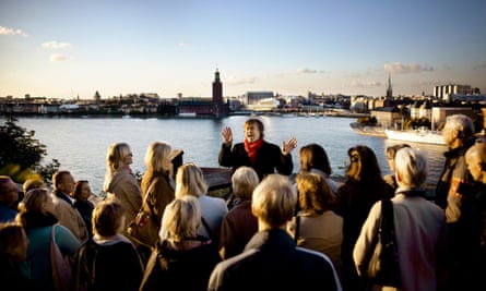 Guests on the Millennium tour in Stockholm, Sweden. The tour takes in city locations relevant to author Stieg Larsson's Millennium trilogy, including The Girl with the Dragon Tattoo.
