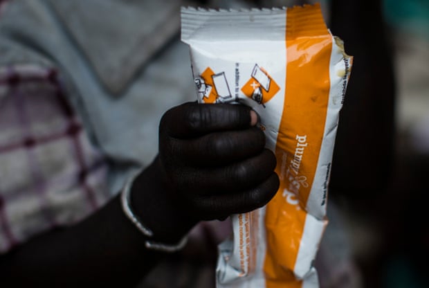 A child holds a packet of Plumpy Soup, donated by Unicef ​​in the village of Rubkuai, Unity State, South Sudan, in 2017.