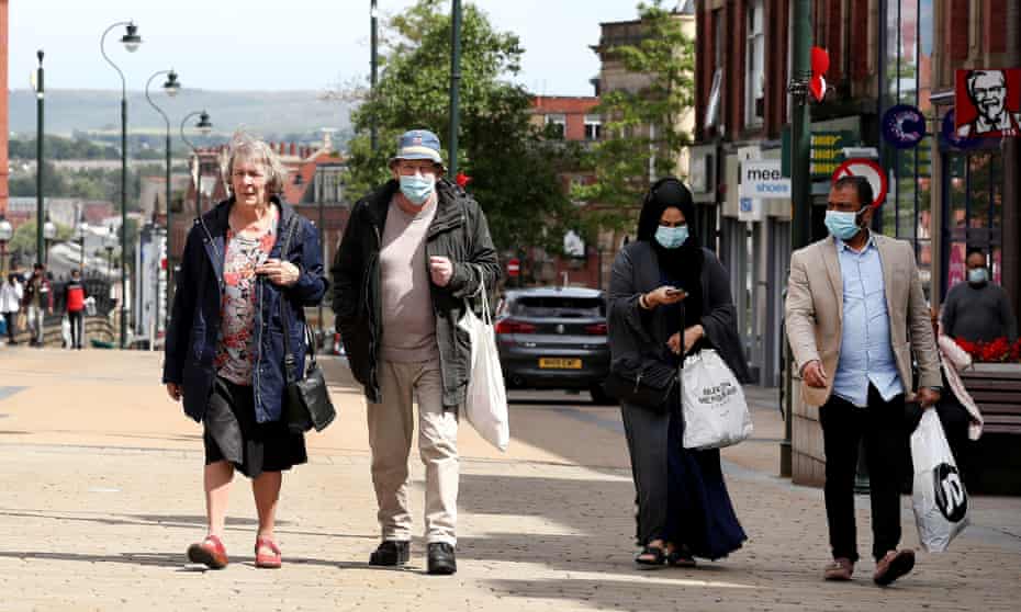 People shopping in Oldham, Greater Manchester.