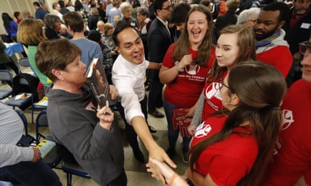 Julián Castro, center, greets Iowa State students at the Story County Democrats’ annual soup supper fundraiser, 23 February 2019, in Ames, Iowa.