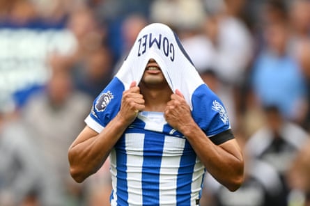 Diego Gómez of Brighton pulls his shirt over his head.