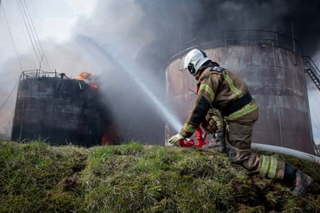 A photograph that is reported to be of a firefighter extinguishing a fire at an oil depot in the Smolensk region was published on Telegram by regional governor Vasily Anokhin on Wednesday.
