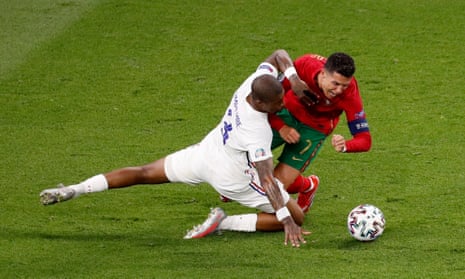 Portugal’s Cristiano Ronaldo is fouled by France’s Presnel Kimpembe.