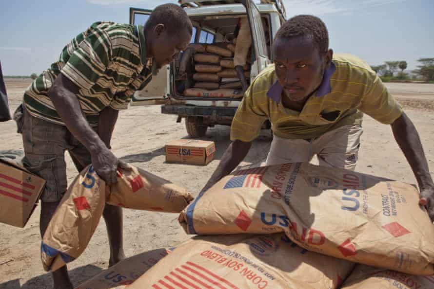 Villagers transport supplementary food provided by the UN World Food Programme during the drought in 2011.