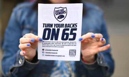 A fan displays a leaflet in protest of the removal of senior concession tickets outside the Tottenham Hotspur Stadium.