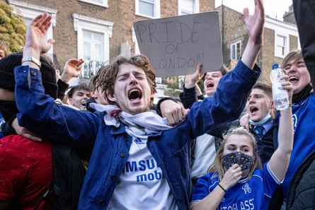 Chelsea fans celebrate outside Stamford Bridge after learning that the club had withdrawn from the Super League.