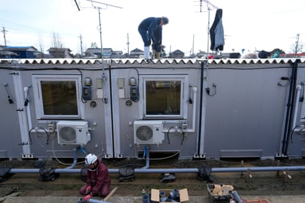 Workers build temporary housing units at a site in Suzu, Ishikawa prefecture.