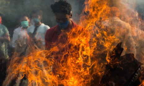 Pyres are prepared to cremate the deceased in Delhi.