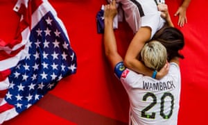 Abby Wambach kisses her then wife after the 2015 World Cup final