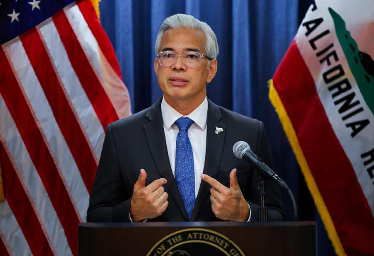 Rob Bonta, California's Attorney General, gestures with both hands while speaking at a podium