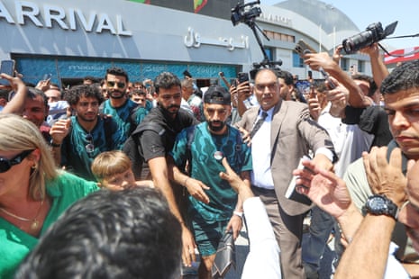 Mohamed Salah smiles as he is greeted by fans.