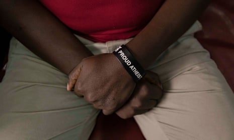 Atheist society member Morris Wanjohi wears the message on his wrist in Nairobi, Kenya this month