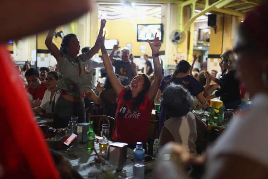 Supporters of the former president Luiz Inácio Lula da Silva celebrate his release from prison at a bar in Rio de Janeiro, Brazil, 8 November
