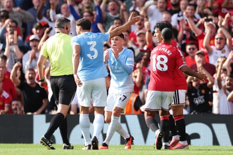Phil Foden of Manchester City reacts as he is shown a red card.