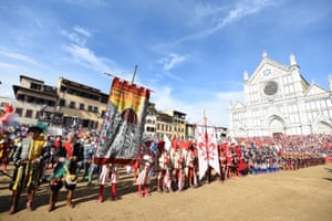Players take part in the game of the ‘Calcio Storico Fiorentino’, a traditional soccer match played in costume, in Florence
