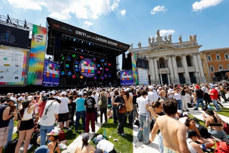 People attend the traditional May Day concert at San Giovanni Square marking International Workers' Day, in Rome, Italy.
