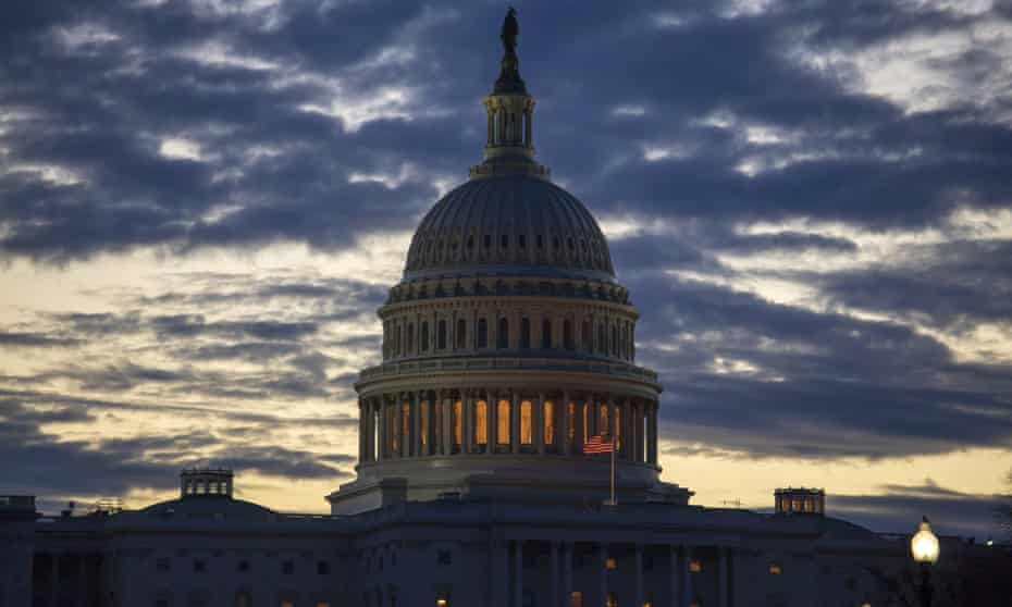 Dawn arrives at the Capitol in Washington, as the partial government shutdown enters day 18 on Tuesday.