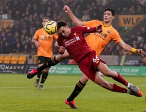 Liverpool’s Trent Alexander-Arnold heads the ball clear before Wolverhampton Wanderers’ Raul Jimenez is able to get to it.