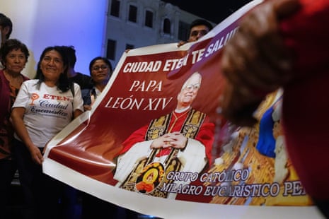 Parishioners display a banner of newly elected Pope Leo XIV at St Mary’s Cathedral.