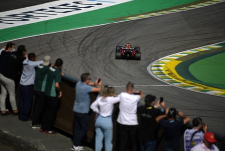 The fans look on as Max Verstappen goes through.