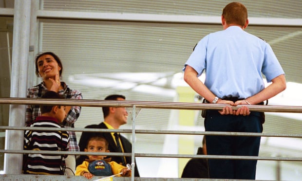 A woman and her children are apprehended by security at the Eurostar terminal.